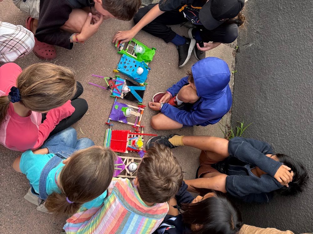 Kids with hand-built crash test dummy rigs