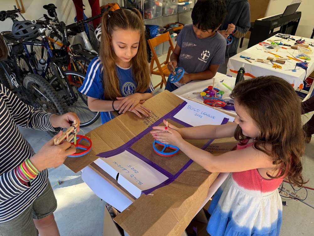 Kids battling hand-built gyroscopic tops