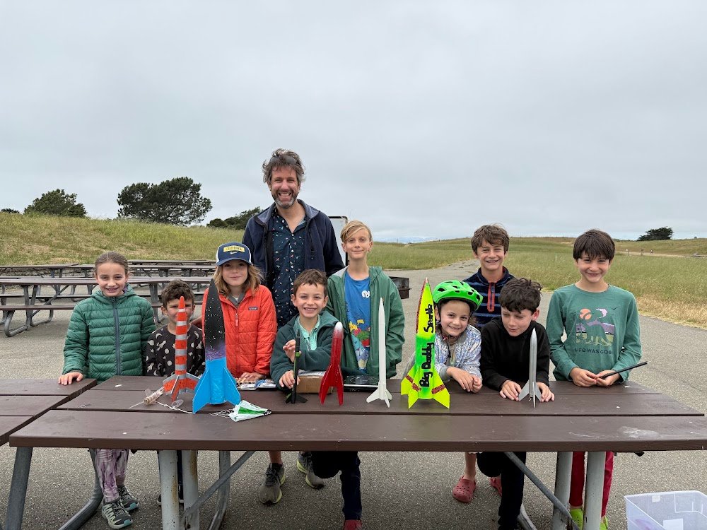 Kids and a leader with model rockets, Rocket Launch session