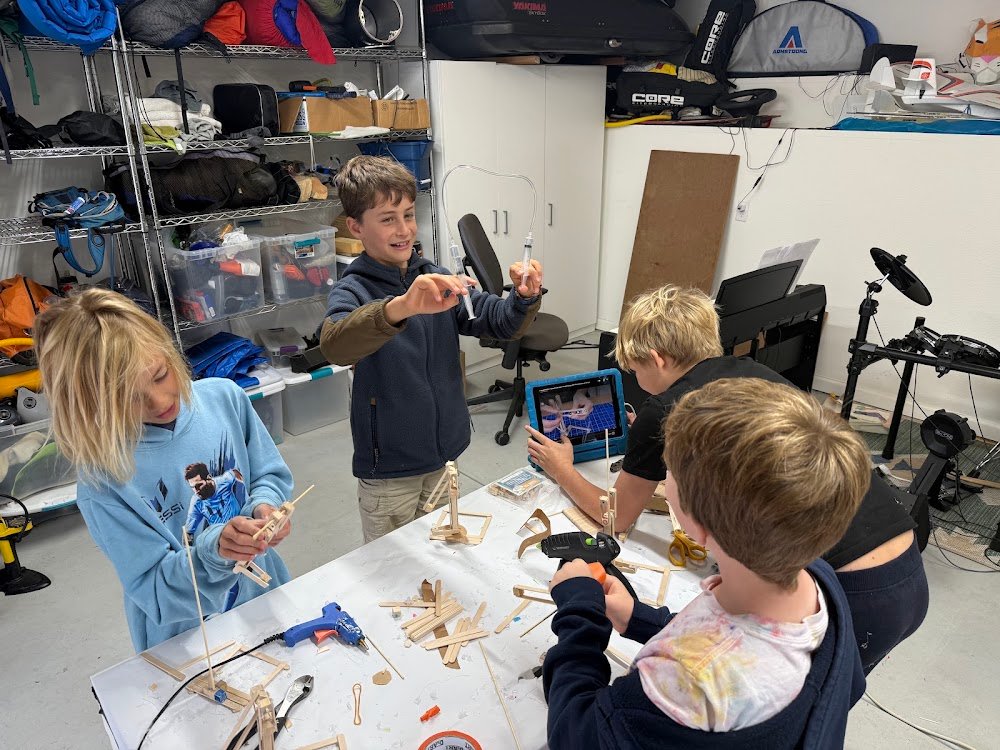 Kids with hydraulic judo robots
