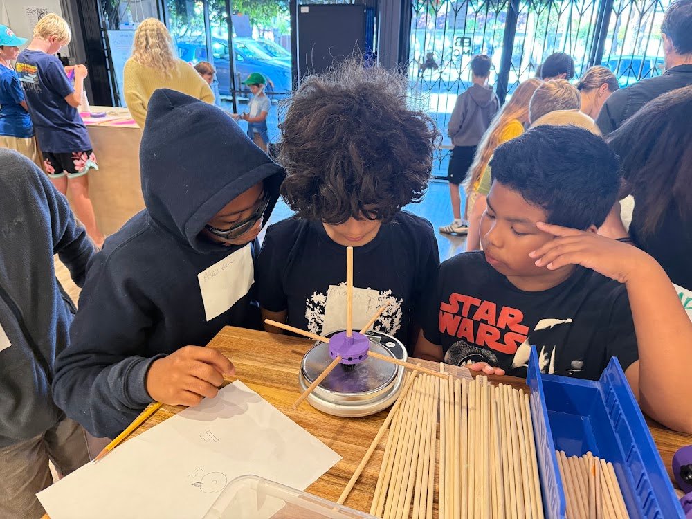 Kids with hand-built wind turbines